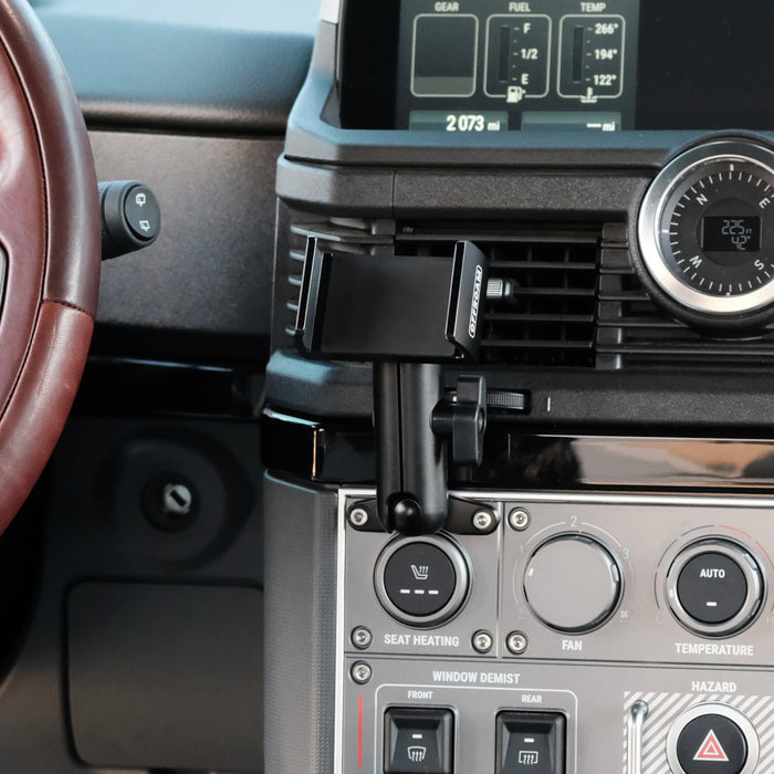 Image of Offroam Phone Mount installed securely in INEOS Grenadier 2022-2026. This premium phone mount installs easily without drilling or glue. Spring loaded Universal holder for use with any phone. Perfect placement without blocking screens, driver view, or air flow. Fully adjustable positioning.
