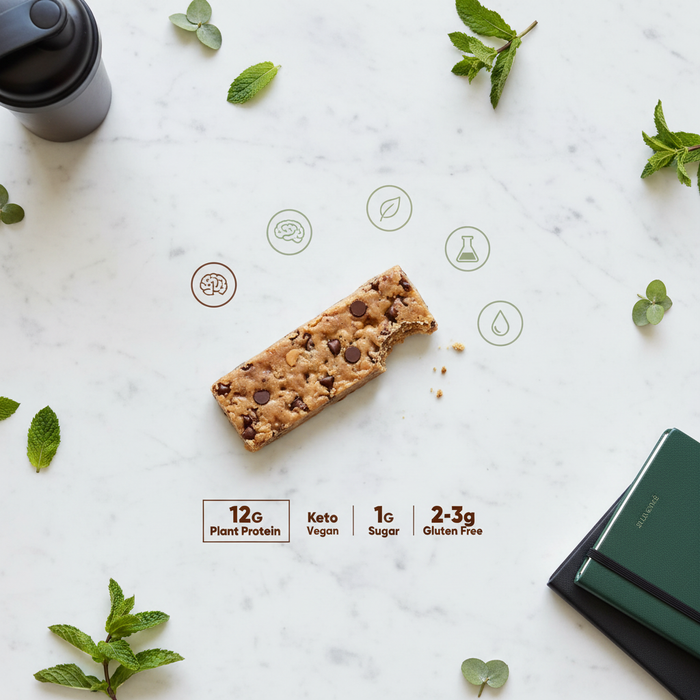 IQBAR protein bar flat lay showing 12G protein 1G sugar keto vegan claims