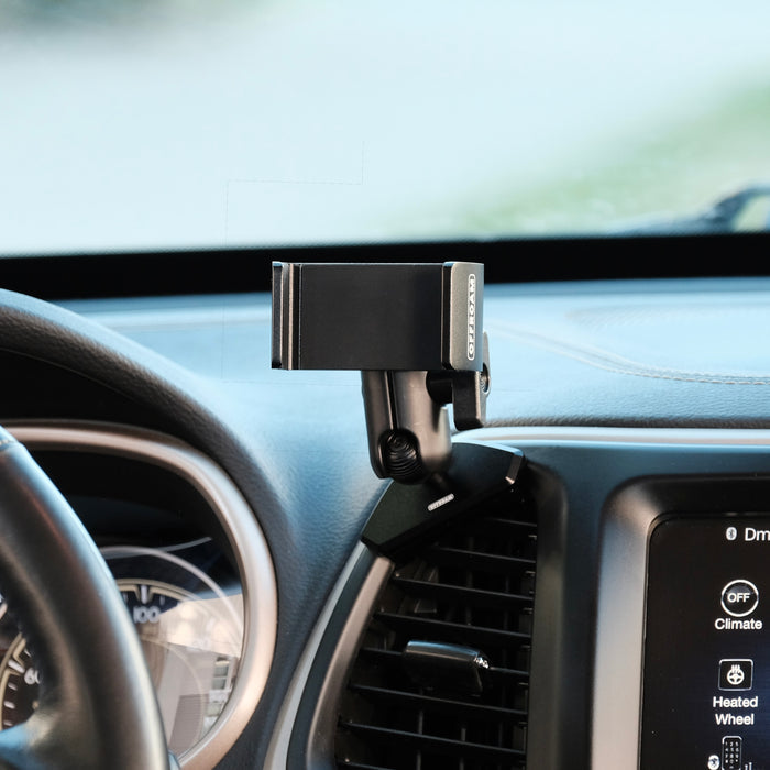 Image of Offroam Phone Mount installed securely in Jeep Cherokee 2014-2018. This premium phone mount installs easily without drilling or glue. Spring loaded Universal holder for use with any phone. Perfect placement without blocking screens, driver view, or air flow. Fully adjustable positioning.