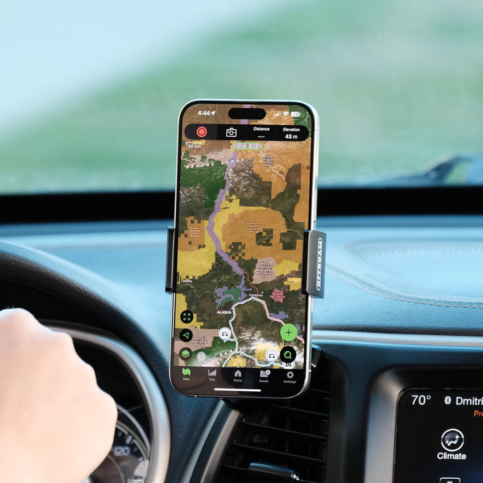 Image of Offroam Phone Mount installed securely in Jeep Cherokee 2014-2018. This premium phone mount installs easily without drilling or glue. Spring loaded Universal holder for use with any phone. Perfect placement without blocking screens, driver view, or air flow. Fully adjustable positioning.