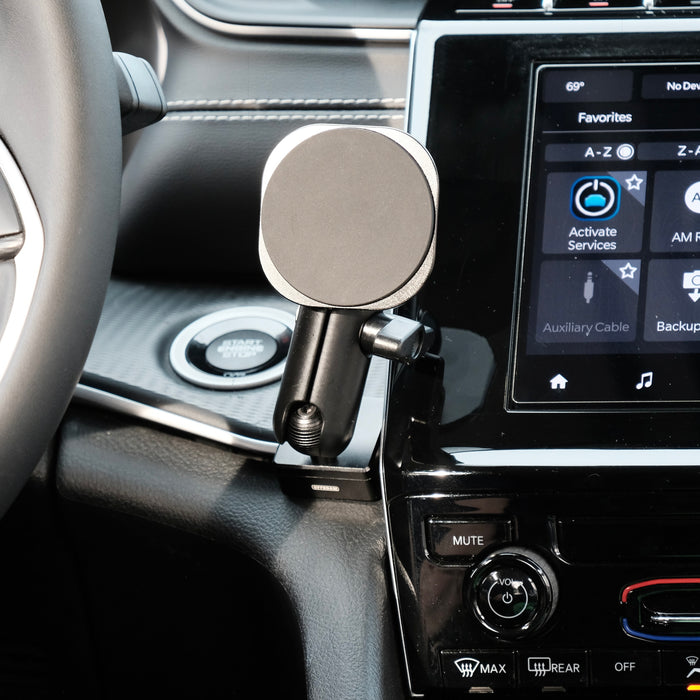 Image of Offroam MagSafe-compatible Phone Mount installed securely in Jeep Grand Cherokee 2022-2026. This premium phone mount installs easily without drilling or glue. High force magnets hold phone on any trail, road, or track. Perfect placement without blocking screens, driver view, or air flow. Fully adjustable positioning.