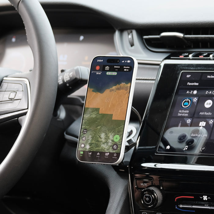 Image of Offroam MagSafe-compatible Phone Mount installed securely in Jeep Grand Cherokee 2022-2026. This premium phone mount installs easily without drilling or glue. High force magnets hold phone on any trail, road, or track. Perfect placement without blocking screens, driver view, or air flow. Fully adjustable positioning.