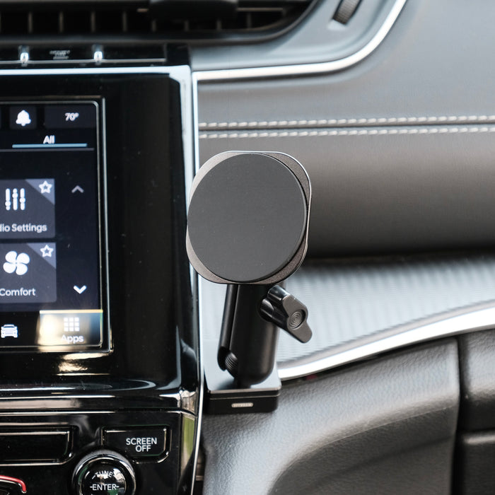 Image of Offroam MagSafe-compatible Phone Mount installed securely on passenger side in Jeep Grand Cherokee 2022-2026. This premium phone mount installs easily without drilling or glue. High force magnets hold phone on any trail, road, or track. Perfect placement without blocking screens, driver view, or air flow. Fully adjustable positioning.