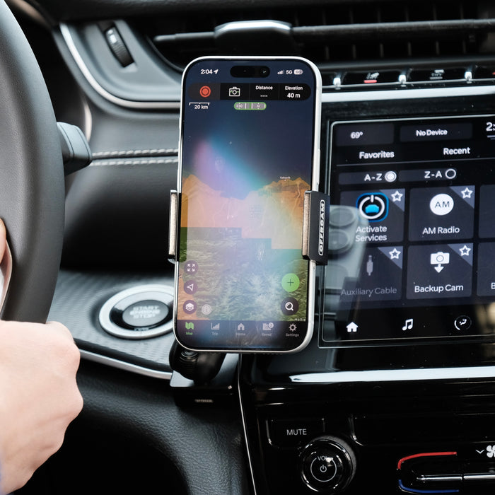 Image of Offroam Phone Mount installed securely in Jeep Grand Cherokee 2022-2026. This premium phone mount installs easily without drilling or glue. Spring loaded Universal holder for use with any phone. Perfect placement without blocking screens, driver view, or air flow. Fully adjustable positioning.