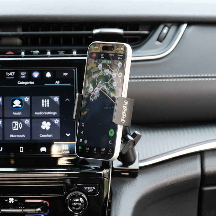 Image of Offroam Phone Mount installed securely on passenger side in Jeep Grand Cherokee 2022-2026. This premium phone mount installs easily without drilling or glue. Spring loaded Universal holder for use with any phone. Perfect placement without blocking screens, driver view, or air flow. Fully adjustable positioning.