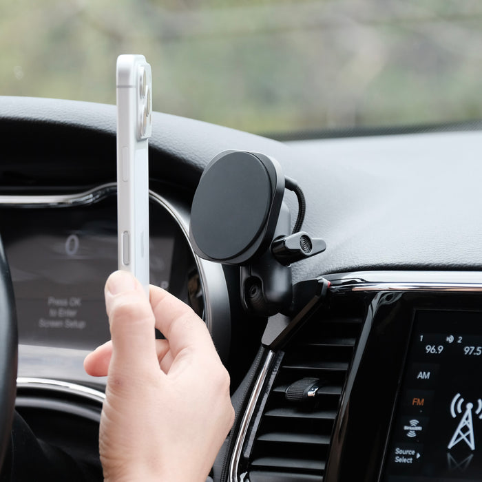 Image of Offroam MagSafe-compatible Phone Mount installed securely in Jeep Grand Cherokee WK2 2014-2022. This premium phone mount installs easily without drilling or glue. High force magnets hold phone on any trail, road, or track. Perfect placement without blocking screens, driver view, or air flow. Fully adjustable positioning.