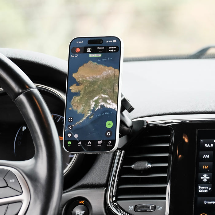 Image of Offroam MagSafe-compatible Phone Mount installed securely in Jeep Grand Cherokee WK2 2014-2022. This premium phone mount installs easily without drilling or glue. High force magnets hold phone on any trail, road, or track. Perfect placement without blocking screens, driver view, or air flow. Fully adjustable positioning.
