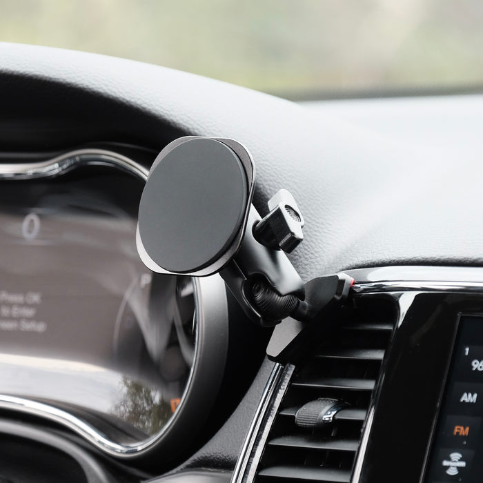 Image of Offroam MagSafe-compatible Phone Mount installed securely in Jeep Grand Cherokee WK2 2014-2022. This premium phone mount installs easily without drilling or glue. High force magnets hold phone on any trail, road, or track. Perfect placement without blocking screens, driver view, or air flow. Fully adjustable positioning.