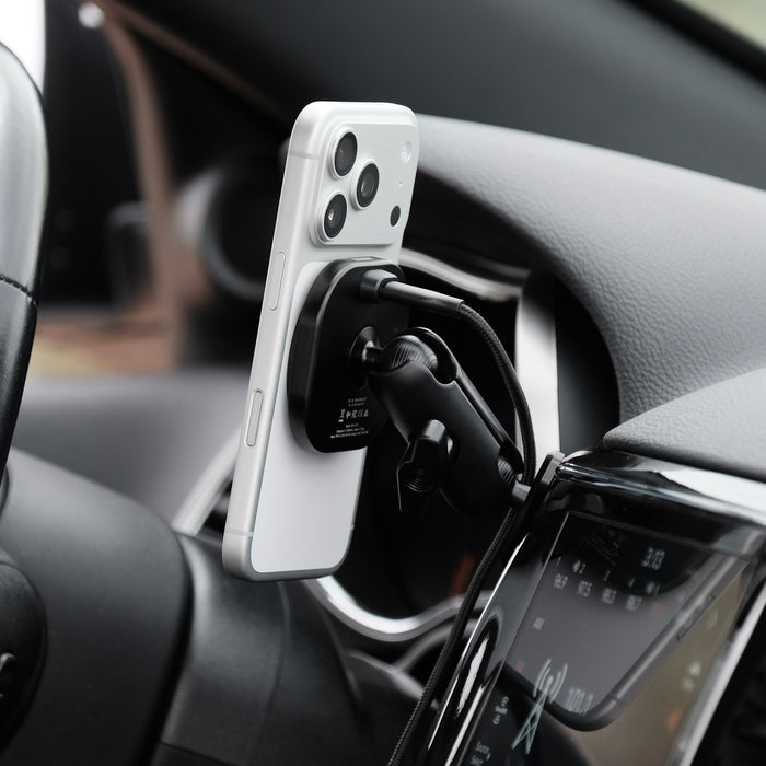 Image of Offroam MagSafe-compatible Phone Mount installed securely in Jeep Grand Cherokee WK2 2014-2022. This premium phone mount installs easily without drilling or glue. High force magnets hold phone on any trail, road, or track. Perfect placement without blocking screens, driver view, or air flow. Fully adjustable positioning.