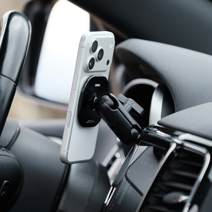 Image of Offroam MagSafe-compatible Phone Mount installed securely in Jeep Grand Cherokee WK2 2014-2022. This premium phone mount installs easily without drilling or glue. High force magnets hold phone on any trail, road, or track. Perfect placement without blocking screens, driver view, or air flow. Fully adjustable positioning.