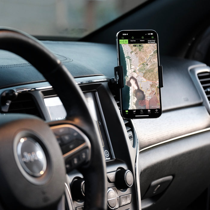 Image of Offroam Phone Mount installed securely in Jeep Grand Cherokee WK2 2014-2022. This premium phone mount installs easily without drilling or glue. Spring loaded Universal holder for use with any phone. Perfect placement without blocking screens, driver view, or air flow. Fully adjustable positioning.