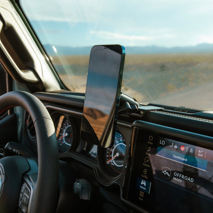 Image of Offroam MagSafe-compatible Phone Mount installed securely in Jeep Wrangler | Gladiator 2024-2026. This premium phone mount installs easily without drilling or glue. High force magnets hold phone on any trail, road, or track. Perfect placement without blocking screens, driver view, or air flow. Fully adjustable positioning.