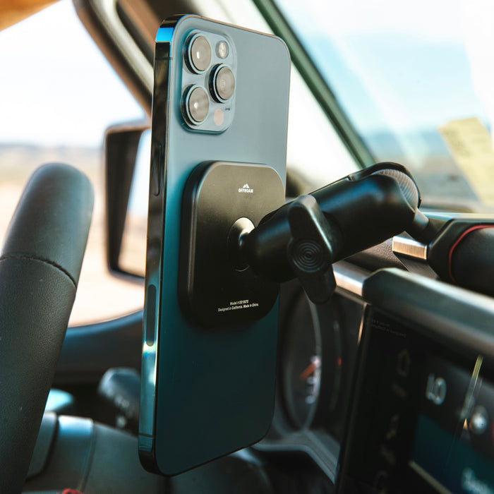 Image of Offroam MagSafe-compatible Phone Mount installed securely in Jeep Wrangler | Gladiator 2024-2026. This premium phone mount installs easily without drilling or glue. High force magnets hold phone on any trail, road, or track. Perfect placement without blocking screens, driver view, or air flow. Fully adjustable positioning.