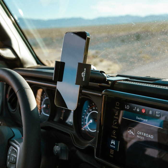 Image of Offroam Phone Mount installed securely in Jeep Wrangler | Gladiator 2024-2026. This premium phone mount installs easily without drilling or glue. Spring loaded Universal holder for use with any phone. Perfect placement without blocking screens, driver view, or air flow. Fully adjustable positioning.