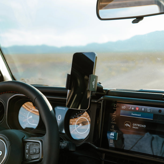 Image of Offroam Phone Mount installed securely in Jeep Wrangler | Gladiator 2024-2026. This premium phone mount installs easily without drilling or glue. Spring loaded Universal holder for use with any phone. Perfect placement without blocking screens, driver view, or air flow. Fully adjustable positioning.