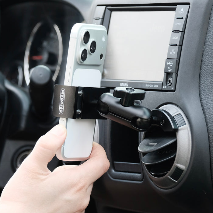 Offroam phone mount with 20mm ball shown installed in Jeep Wrangler JK 2011-2018 air vent bezel without blocking air flow holding the phone securely on off-road trails with mechanical strong force and one-hand docking & removal.