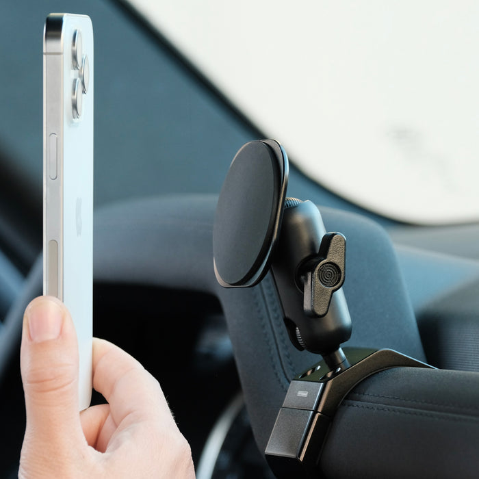 Image of Offroam MagSafe-compatible Phone Mount installed securely in Land Rover Defender 2020-2026. This premium phone mount installs easily without drilling or glue. High force magnets hold phone on any trail, road, or track. Perfect placement without blocking screens, driver view, or air flow. Fully adjustable positioning.