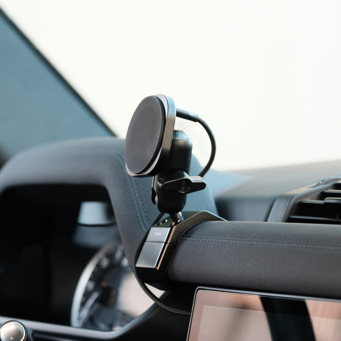 Image of Offroam MagSafe-compatible Phone Mount installed securely in Land Rover Defender 2020-2026. This premium phone mount installs easily without drilling or glue. High force magnets hold phone on any trail, road, or track. Perfect placement without blocking screens, driver view, or air flow. Fully adjustable positioning.