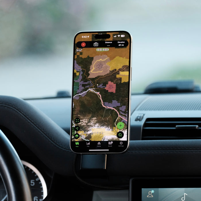 Image of Offroam MagSafe-compatible Phone Mount installed securely in Land Rover Defender 2020-2026. This premium phone mount installs easily without drilling or glue. High force magnets hold phone on any trail, road, or track. Perfect placement without blocking screens, driver view, or air flow. Fully adjustable positioning.
