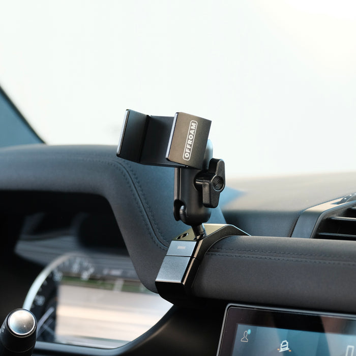 Image of Offroam Phone Mount installed securely in Land Rover Defender 2020-2026. This premium phone mount installs easily without drilling or glue. Spring loaded Universal holder for use with any phone. Perfect placement without blocking screens, driver view, or air flow. Fully adjustable positioning.