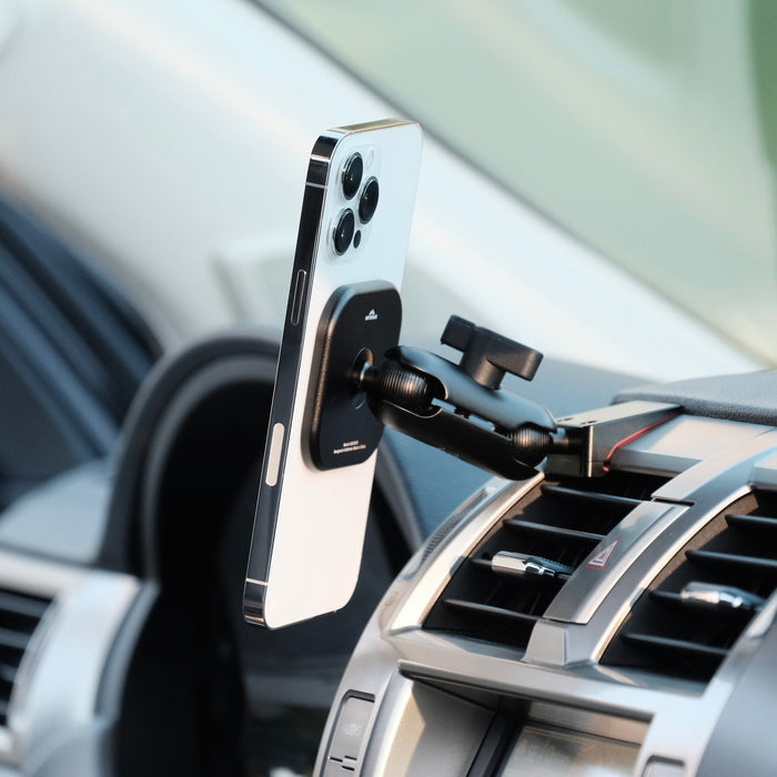 Image of Offroam MagSafe-compatible Phone Mount installed securely in Lexus GX 460 2010-2021. This premium phone mount installs easily without drilling or glue. High force magnets hold phone on any trail, road, or track. Perfect placement without blocking screens, driver view, or air flow. Fully adjustable positioning.