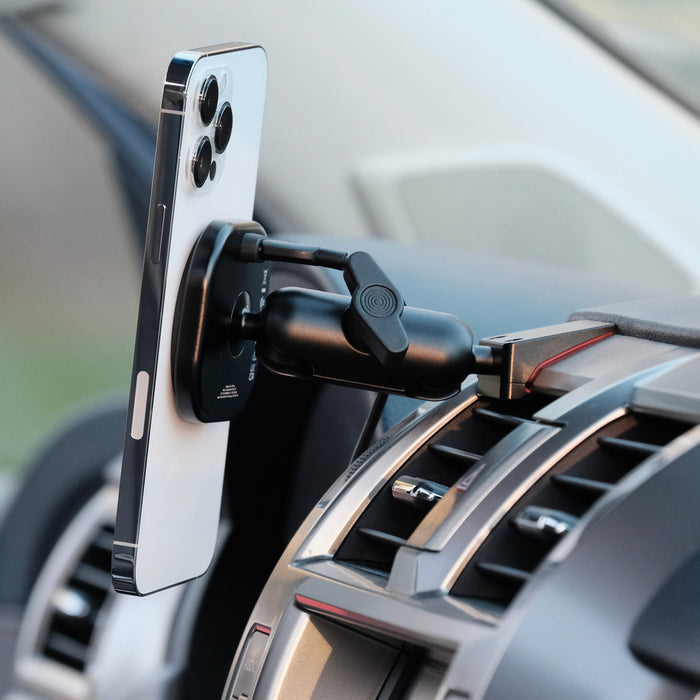 Image of Offroam MagSafe-compatible Phone Mount installed securely in Lexus GX 460 2010-2021. This premium phone mount installs easily without drilling or glue. High force magnets hold phone on any trail, road, or track. Perfect placement without blocking screens, driver view, or air flow. Fully adjustable positioning.