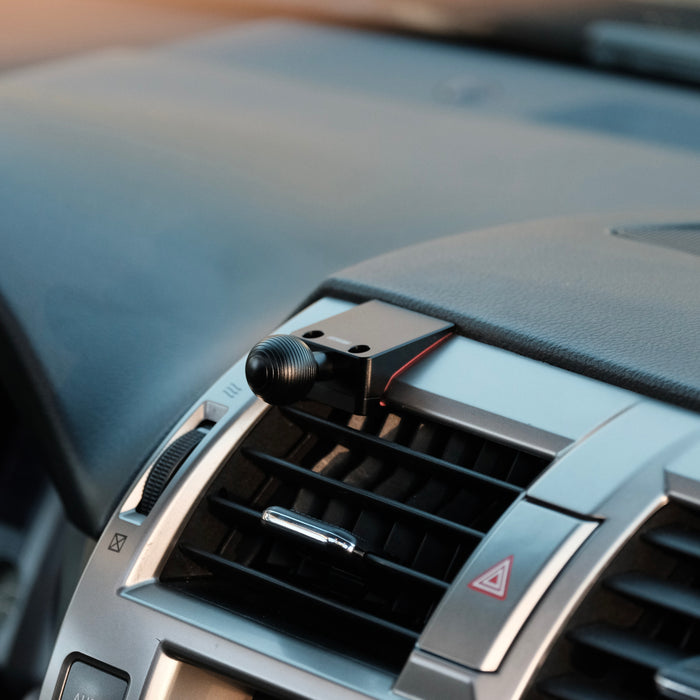 Image of Offroam Mounting Base installed securely in Lexus GX 460 2010-2021. This premium all metal phone mounting base installs easily without drilling or glue. Perfect placement without blocking screens, driver view, or air flow.