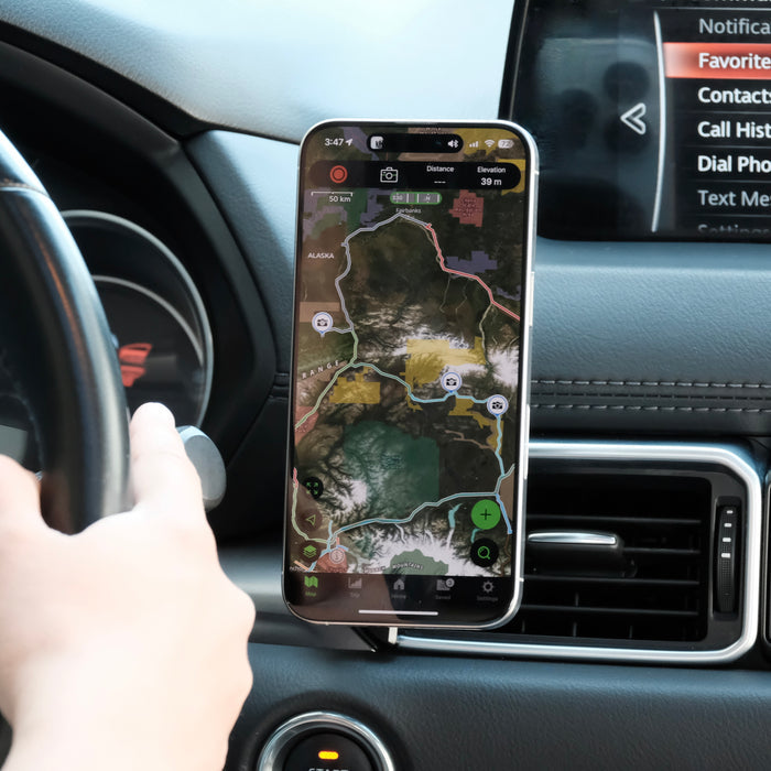 Image of Offroam MagSafe-compatible Phone Mount installed securely in Mazda CX-5 2017-2025. This premium phone mount installs easily without drilling or glue. High force magnets hold phone on any trail, road, or track. Perfect placement without blocking screens, driver view, or air flow. Fully adjustable positioning.