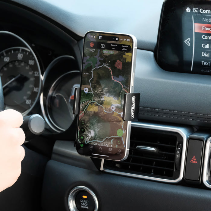 Image of Offroam Phone Mount installed securely in Mazda CX-5 2017-2025. This premium phone mount installs easily without drilling or glue. Spring loaded Universal holder for use with any phone. Perfect placement without blocking screens, driver view, or air flow. Fully adjustable positioning.
