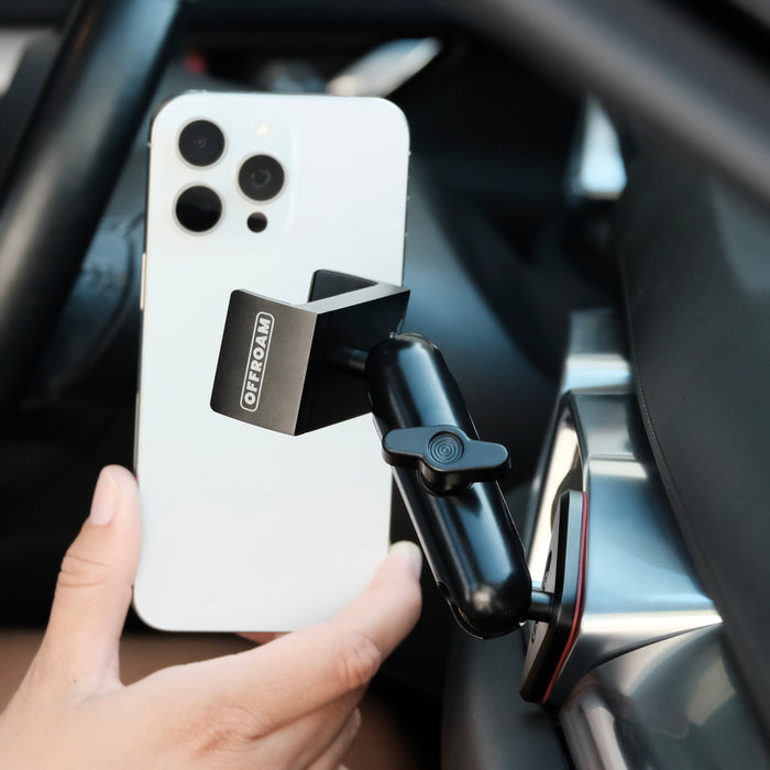 Image of Offroam Phone Mount installed securely in Mazda CX-5 2017-2025. This premium phone mount installs easily without drilling or glue. Spring loaded Universal holder for use with any phone. Perfect placement without blocking screens, driver view, or air flow. Fully adjustable positioning.
