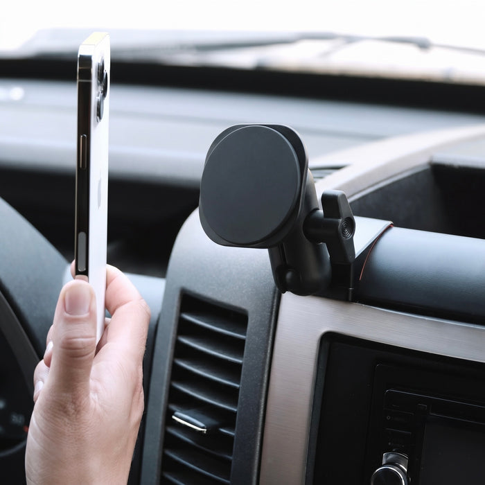 Image of Offroam MagSafe-compatible Phone Mount installed securely in Mercedes-Benz Sprinter 2007-2018. This premium phone mount installs easily without drilling or glue. High force magnets hold phone on any trail, road, or track. Perfect placement without blocking screens, driver view, or air flow. Fully adjustable positioning.