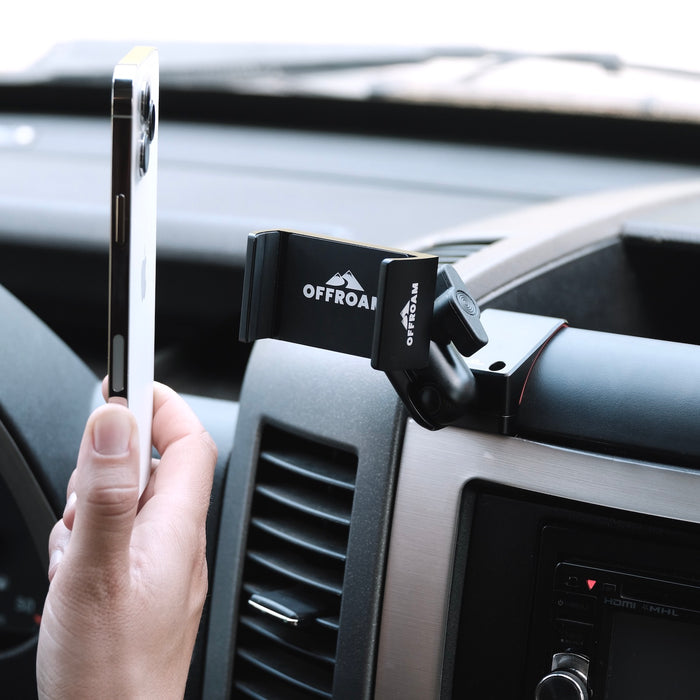 Image of Offroam Phone Mount installed securely in Mercedes-Benz Sprinter 2007-2018. This premium phone mount installs easily without drilling or glue. Spring loaded Universal holder for use with any phone. Perfect placement without blocking screens, driver view, or air flow. Fully adjustable positioning.