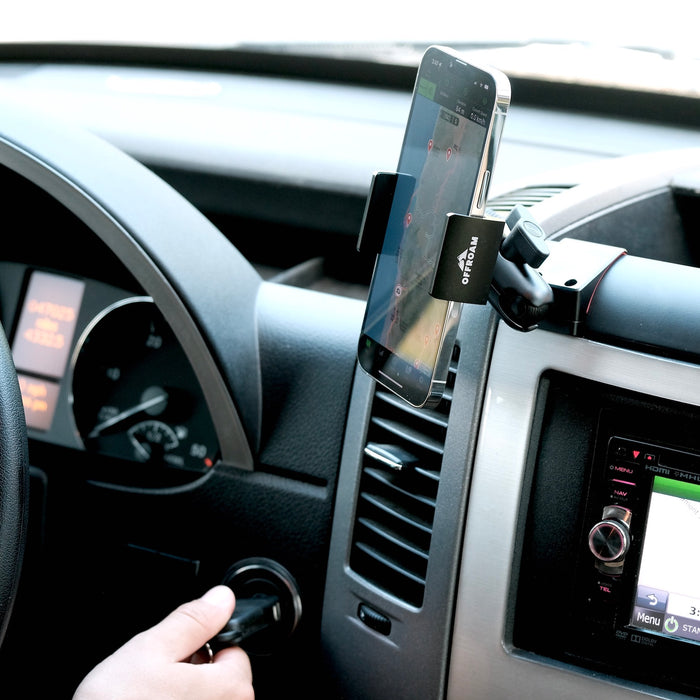 Image of Offroam Phone Mount installed securely in Mercedes-Benz Sprinter 2007-2018. This premium phone mount installs easily without drilling or glue. Spring loaded Universal holder for use with any phone. Perfect placement without blocking screens, driver view, or air flow. Fully adjustable positioning.