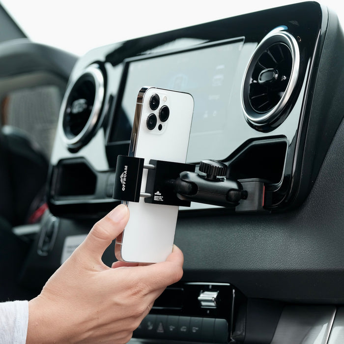 Image of Offroam Phone Mount installed securely in Mercedes-Benz Sprinter 2019-2026. This premium phone mount installs easily without drilling or glue. Spring loaded Universal holder for use with any phone. Perfect placement without blocking screens, driver view, or air flow. Fully adjustable positioning.