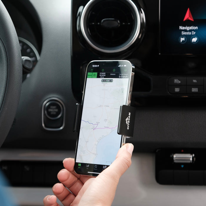 Image of Offroam Phone Mount installed securely in Mercedes-Benz Sprinter 2019-2026. This premium phone mount installs easily without drilling or glue. Spring loaded Universal holder for use with any phone. Perfect placement without blocking screens, driver view, or air flow. Fully adjustable positioning.