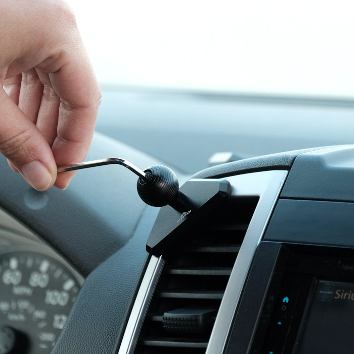 Image of Offroam Mounting Base installed securely in Nissan Frontier 2009-2021 | Xterra 2009-2015. This premium all metal phone mounting base installs easily without drilling or glue. Perfect placement without blocking screens, driver view, or air flow.