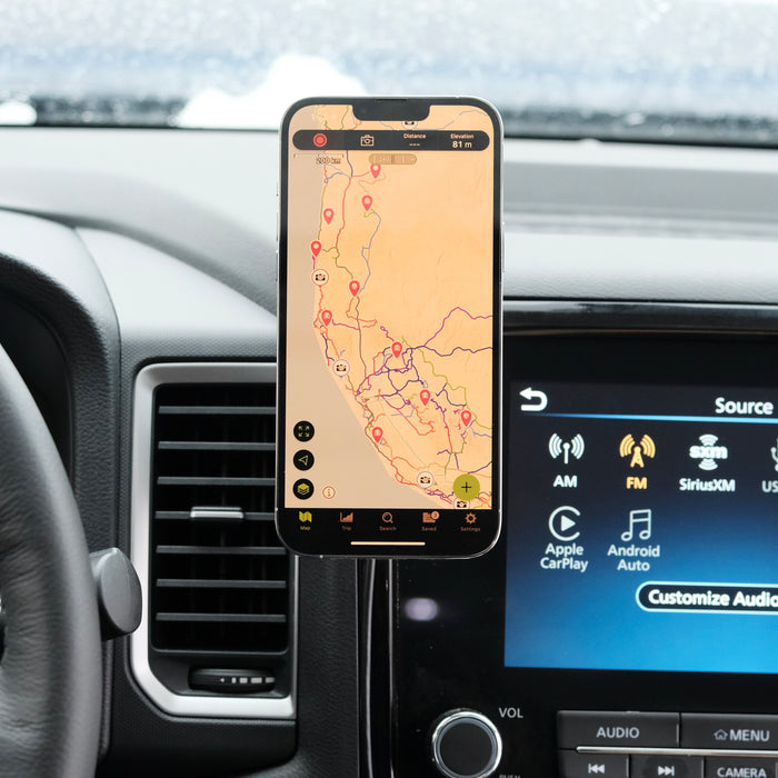 Image of Offroam MagSafe-compatible Phone Mount installed securely in Nissan Frontier 2022-2024. This premium phone mount installs easily without drilling or glue. High force magnets hold phone on any trail, road, or track. Perfect placement without blocking screens, driver view, or air flow. Fully adjustable positioning.