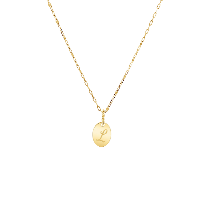14K solid yellow gold disc with an engraved capital letter in script font and large bail made of twisted gold wire hanging on a 14k yellow gold sequin chain.