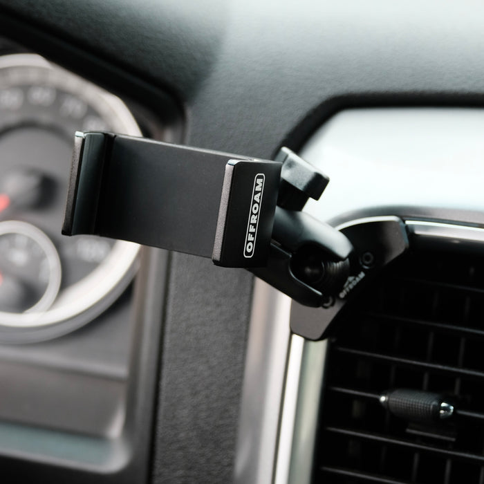Image of Offroam Phone Mount installed securely in Ram 1500/2500/3500 2013-2018 & Ram Classic 2019-2024. This premium phone mount installs easily without drilling or glue. Spring loaded Universal holder for use with any phone. Perfect placement without blocking screens, driver view, or air flow. Fully adjustable positioning.