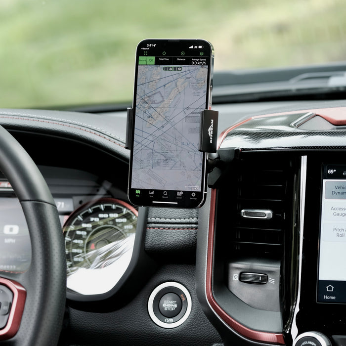 Image of Offroam Phone Mount installed securely in Ram 1500/2500/3500 2019-2026. This premium phone mount installs easily without drilling or glue. Spring loaded Universal holder for use with any phone. Perfect placement without blocking screens, driver view, or air flow. Fully adjustable positioning.