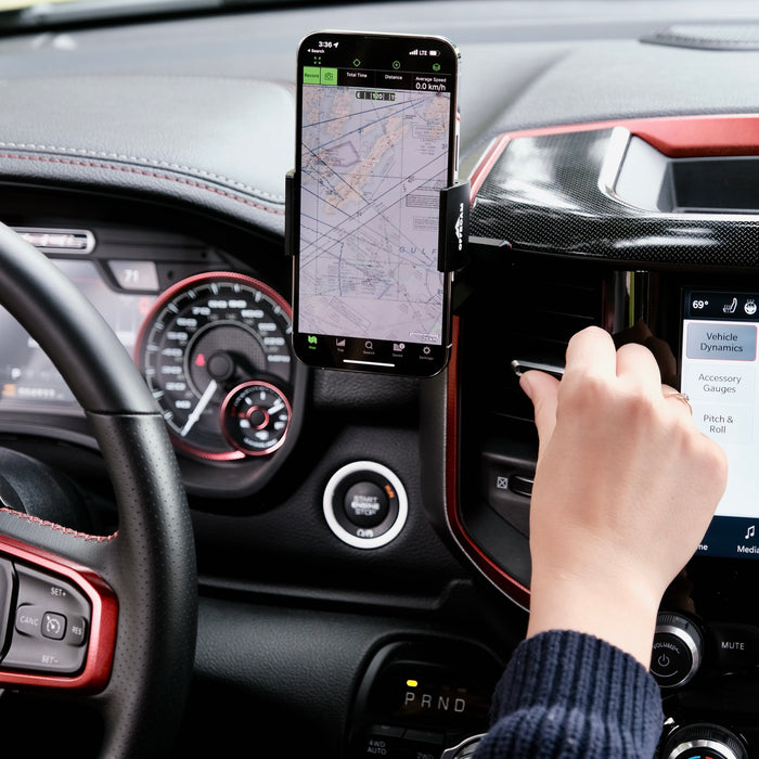 Image of Offroam Phone Mount installed securely in Ram 1500/2500/3500 2019-2026. This premium phone mount installs easily without drilling or glue. Spring loaded Universal holder for use with any phone. Perfect placement without blocking screens, driver view, or air flow. Fully adjustable positioning.