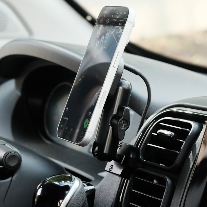 Image of Offroam MagSafe-compatible Phone Mount installed securely in RAM ProMaster 2022-2026. This premium phone mount installs easily without drilling or glue. High force magnets hold phone on any trail, road, or track. Perfect placement without blocking screens, driver view, or air flow. Fully adjustable positioning.