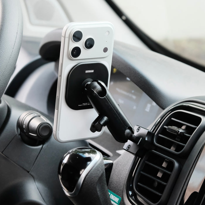Image of Offroam MagSafe-compatible Phone Mount installed securely in RAM ProMaster 2022-2026. This premium phone mount installs easily without drilling or glue. High force magnets hold phone on any trail, road, or track. Perfect placement without blocking screens, driver view, or air flow. Fully adjustable positioning.