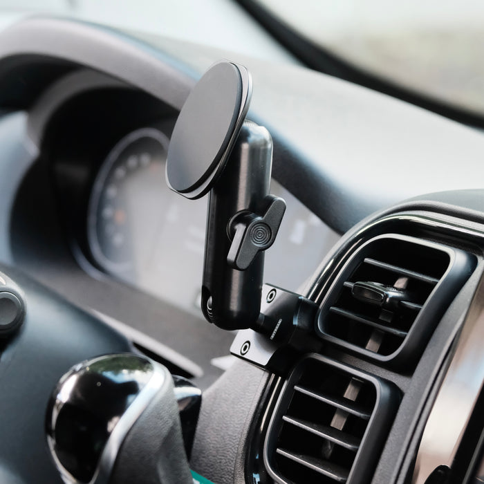 Image of Offroam MagSafe-compatible Phone Mount installed securely in RAM ProMaster 2022-2026. This premium phone mount installs easily without drilling or glue. High force magnets hold phone on any trail, road, or track. Perfect placement without blocking screens, driver view, or air flow. Fully adjustable positioning.