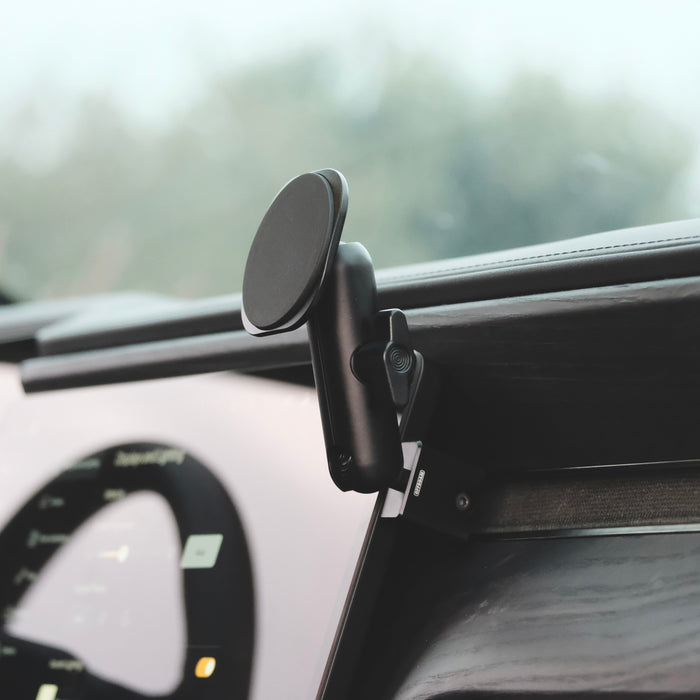 Image of Offroam MagSafe-compatible Phone Mount installed securely in Rivian R1T | R1S 2022-2026. This premium phone mount installs easily without drilling or glue. High force magnets hold phone on any trail, road, or track. Perfect placement without blocking screens, driver view, or air flow. Fully adjustable positioning.