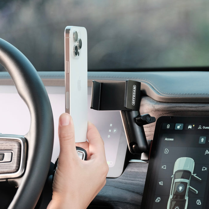 Image of Offroam Phone Mount installed securely in Rivian R1T | R1S 2022-2026. This premium phone mount installs easily without drilling or glue. Spring loaded Universal holder for use with any phone. Perfect placement without blocking screens, driver view, or air flow. Fully adjustable positioning.