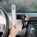Image of Offroam Phone Mount installed securely in Rivian R1T | R1S 2022-2026. This premium phone mount installs easily without drilling or glue. Spring loaded Universal holder for use with any phone. Perfect placement without blocking screens, driver view, or air flow. Fully adjustable positioning.