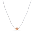 A strand necklace of micro white pearls with purple star shaped pearl.