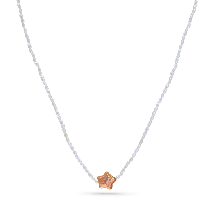 A strand necklace of micro white pearls with purple star shaped pearl.