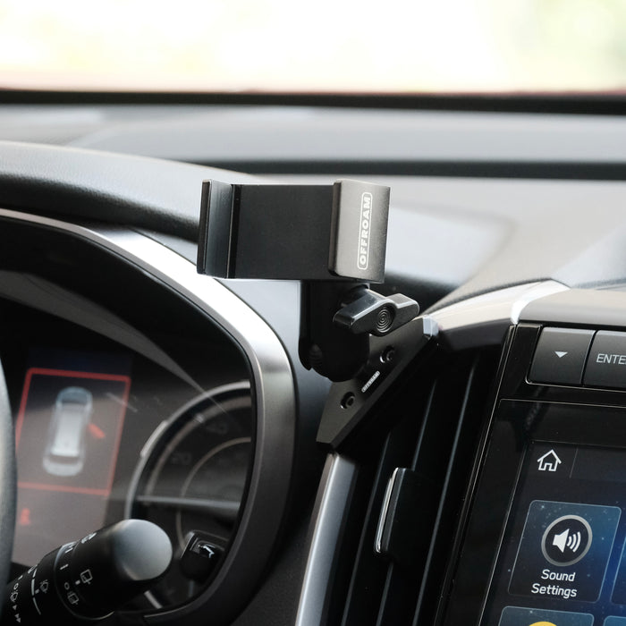 Image of Offroam Phone Mount installed securely in Subaru Ascent 2019-2022. This premium phone mount installs easily without drilling or glue. Spring loaded Universal holder for use with any phone. Perfect placement without blocking screens, driver view, or air flow. Fully adjustable positioning.